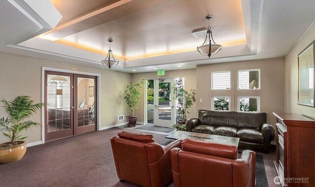 300 10th Ave Unit A310, Seattle, WA 98122 - carpeted living room with french doors and a raised ceiling