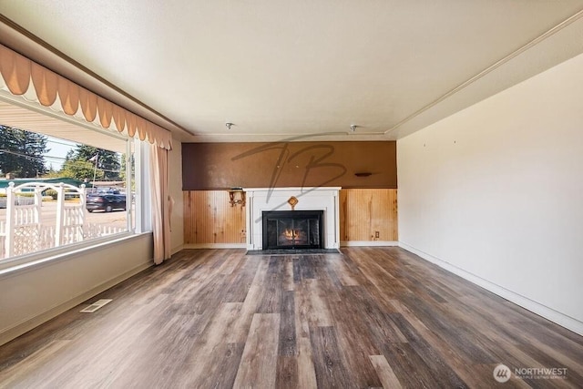 1727 E 64th St, Tacoma, WA 98404 - unfurnished living room with wood finished floors and a fireplace with flush hearth