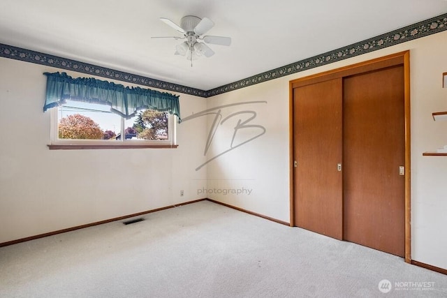 1727 E 64th St, Tacoma, WA 98404 - unfurnished bedroom featuring carpet flooring, a closet, and a ceiling fan