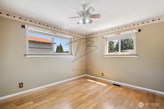 1727 E 64th St, Tacoma, WA 98404 - empty room with wood finished floors and ceiling fan