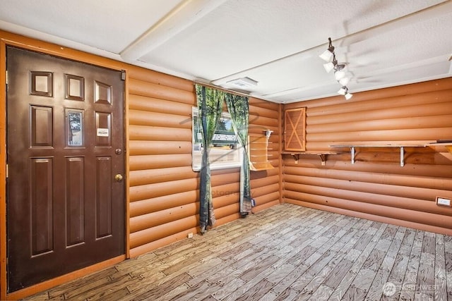 1727 E 64th St, Tacoma, WA 98404 - entrance foyer featuring log walls and wood finished floors