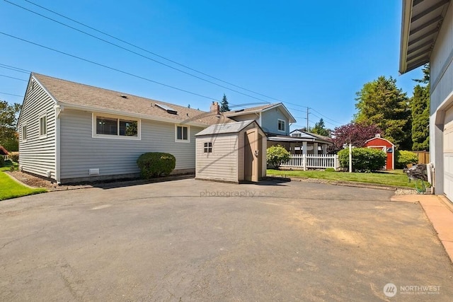 1727 E 64th St, Tacoma, WA 98404 - back of house with a shed