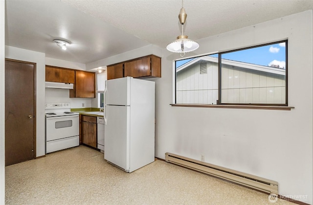 1200 Lenora Ct, Bellingham, WA 98225 - kitchen with white appliances, a baseboard radiator, under cabinet range hood, brown cabinets, and hanging light fixtures