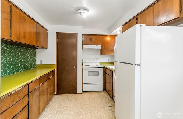 1200 Lenora Ct, Bellingham, WA 98225 - kitchen with white appliances, custom range hood, and brown cabinets
