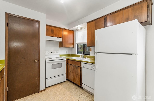 1200 Lenora Ct, Bellingham, WA 98225 - kitchen featuring white appliances, under cabinet range hood, light floors, brown cabinetry, and light countertops