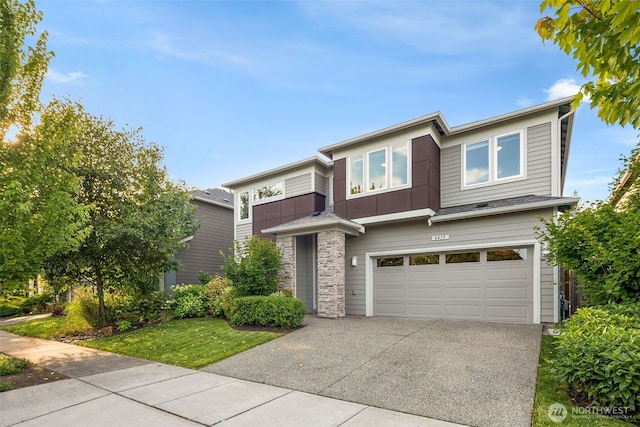 4419 141st Pl SE, Snohomish, WA 98296 - view of front facade with a garage, driveway, and stone siding
