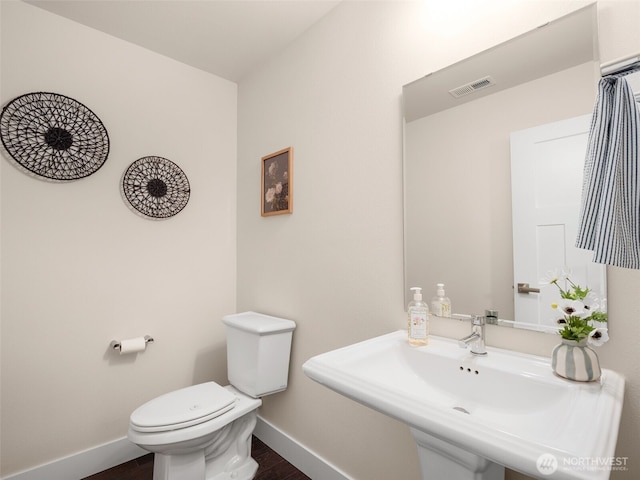 4419 141st Pl SE, Snohomish, WA 98296 - bathroom featuring baseboards and wood finished floors