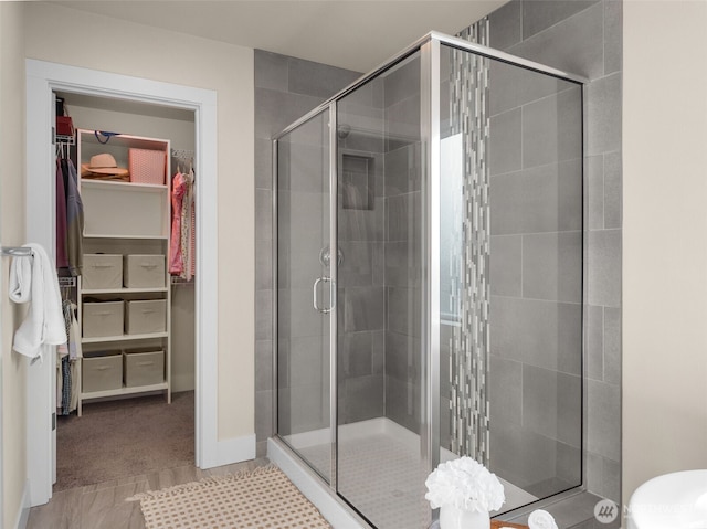 4419 141st Pl SE, Snohomish, WA 98296 - full bathroom featuring a stall shower and a spacious closet