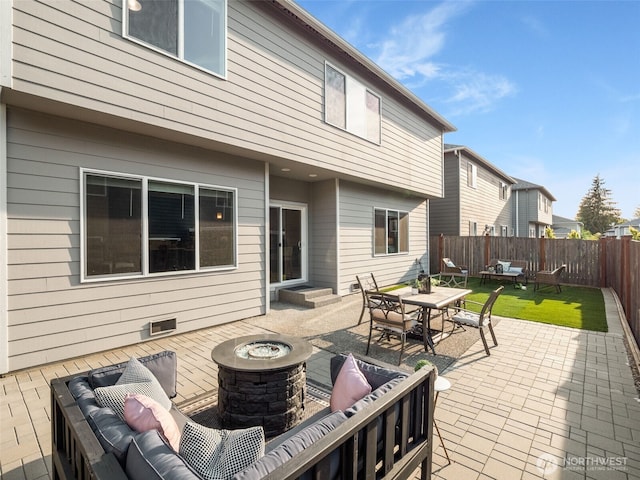 4419 141st Pl SE, Snohomish, WA 98296 - fenced backyard featuring an outdoor living space with a fire pit and a patio