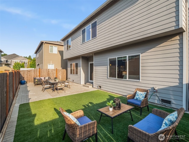 4419 141st Pl SE, Snohomish, WA 98296 - back of property featuring a fenced backyard, entry steps, outdoor lounge area, and a patio