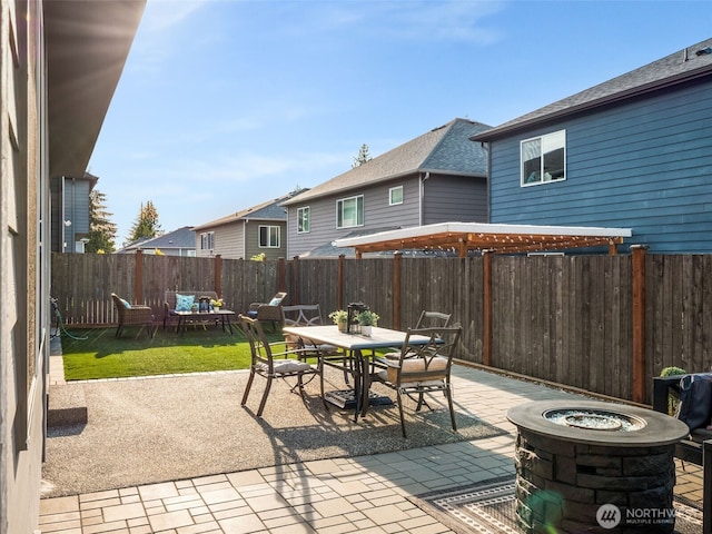 4419 141st Pl SE, Snohomish, WA 98296 - fenced backyard with outdoor dining space, a fire pit, a patio, and a residential view