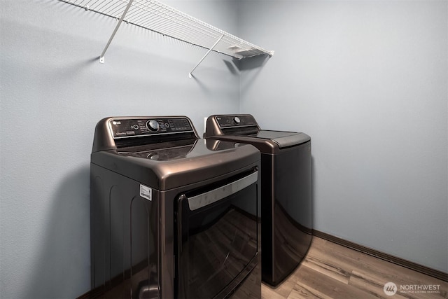 830 Mill Ave, Snohomish, WA 98290 - laundry area featuring washer and clothes dryer and light wood-style flooring