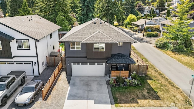 830 Mill Ave, Snohomish, WA 98290 - view of front of home featuring driveway, a garage, stucco siding, and roof with shingles