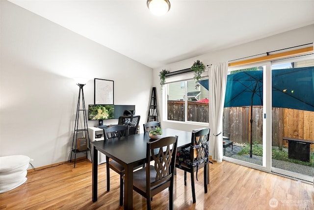 6036 Park St E, Fife, WA 98424 - dining space featuring light wood-style floors, plenty of natural light, lofted ceiling, and a desk