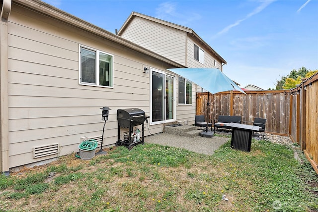 6036 Park St E, Fife, WA 98424 - back of property with a fenced backyard and a patio area