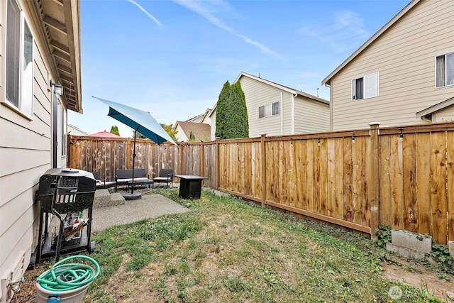6036 Park St E, Fife, WA 98424 - fenced backyard with a patio and an outdoor living space