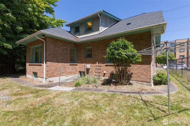 314 E 2nd St, Port Angeles, WA 98362 - back of property with brick siding and a shingled roof