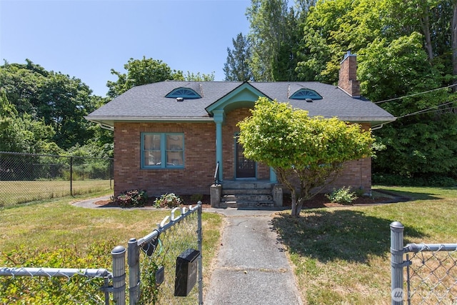 314 E 2nd St, Port Angeles, WA 98362 - view of front facade featuring brick siding, a chimney, roof with shingles, and entry steps