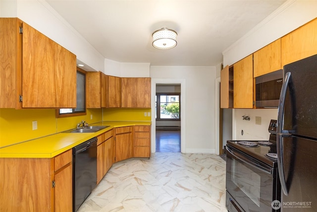 314 E 2nd St, Port Angeles, WA 98362 - kitchen featuring black appliances, light marble finish flooring, light countertops, and brown cabinets