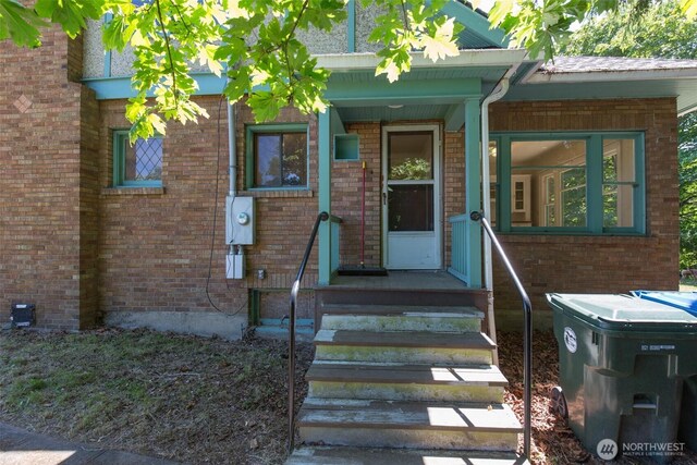 314 E 2nd St, Port Angeles, WA 98362 - doorway to property featuring brick siding