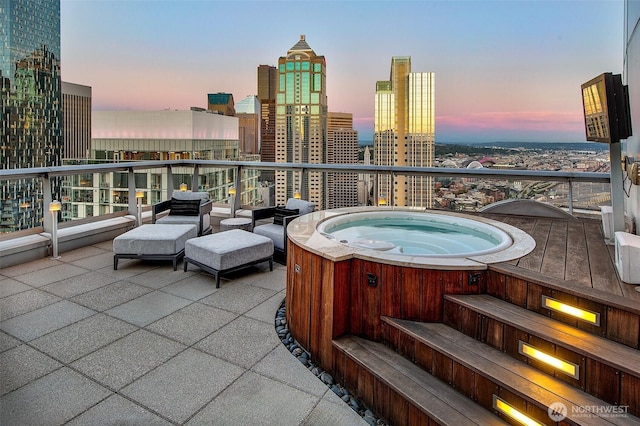 1521 2nd Ave Unit 3801, Seattle, WA 98101 - patio terrace at dusk with a hot tub and a view of city