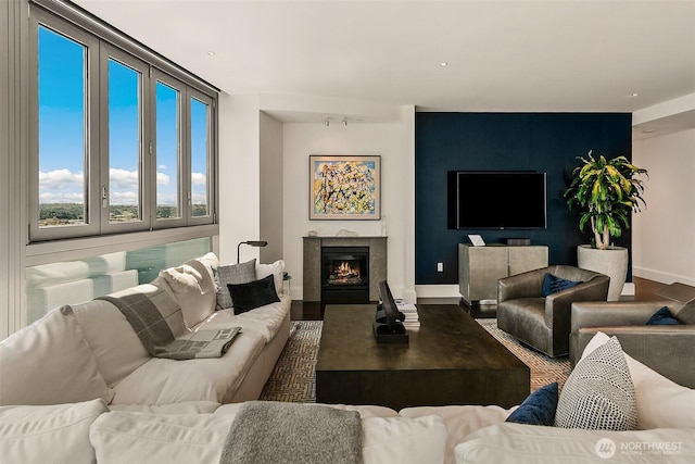 1521 2nd Ave Unit 3801, Seattle, WA 98101 - living area with a lit fireplace and wood finished floors