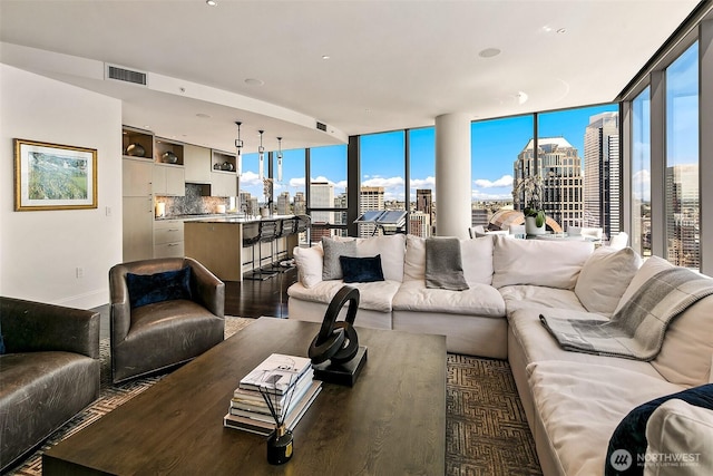 1521 2nd Ave Unit 3801, Seattle, WA 98101 - living area with a view of skyline and wood finished floors