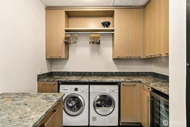 1521 2nd Ave Unit 3801, Seattle, WA 98101 - laundry room with cabinet space, beverage cooler, washing machine and dryer, and a dry bar