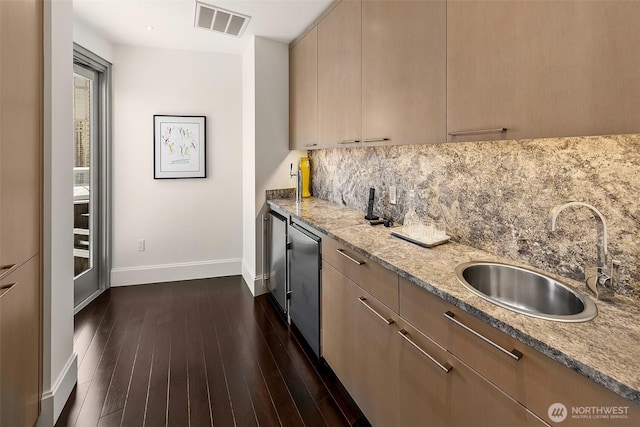 1521 2nd Ave Unit 3801, Seattle, WA 98101 - kitchen featuring backsplash, light stone countertops, dark wood-type flooring, modern cabinets, and fridge