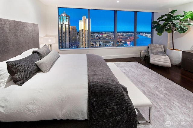 1521 2nd Ave Unit 3801, Seattle, WA 98101 - bedroom featuring wood finished floors and a view of city