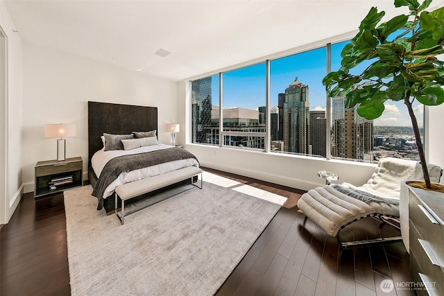 1521 2nd Ave Unit 3801, Seattle, WA 98101 - bedroom featuring dark wood finished floors and a view of skyline