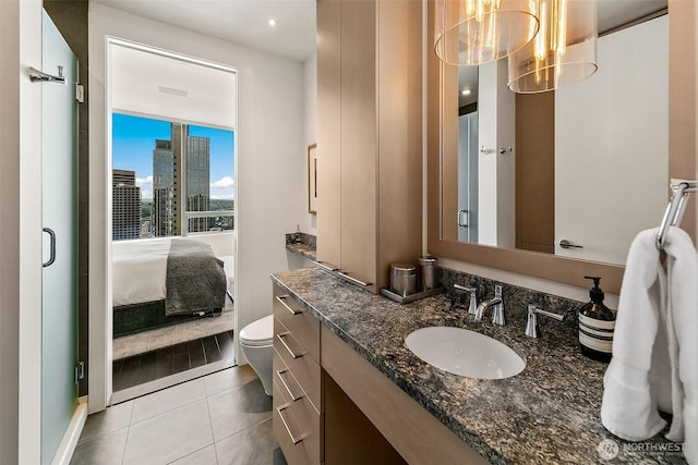 1521 2nd Ave Unit 3801, Seattle, WA 98101 - ensuite bathroom with vanity, tile patterned flooring, a view of city, and recessed lighting