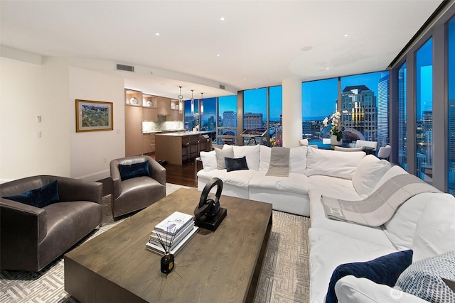 1521 2nd Ave Unit 3801, Seattle, WA 98101 - living area featuring a city view, a wall of windows, and recessed lighting