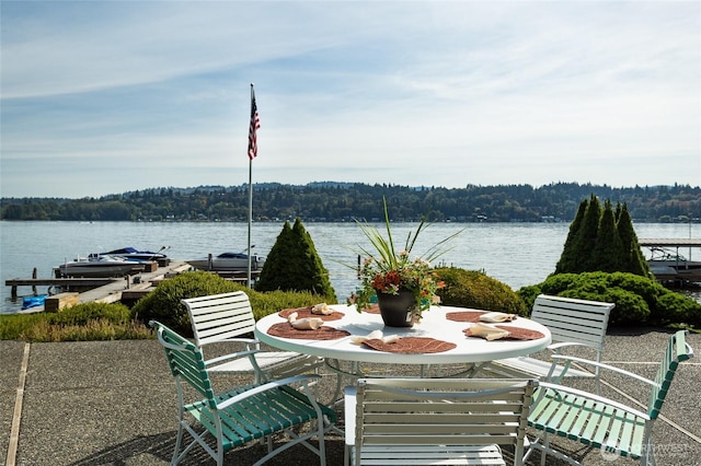 4802 E Mercer Way, Mercer Island, WA 98040 - view of patio / terrace featuring a water view, a view of trees, outdoor dining area, and a boat dock