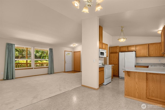 4050 NE 197th St, Lake Forest Park, WA 98155 - kitchen featuring white appliances, lofted ceiling, open floor plan, light countertops, and a chandelier