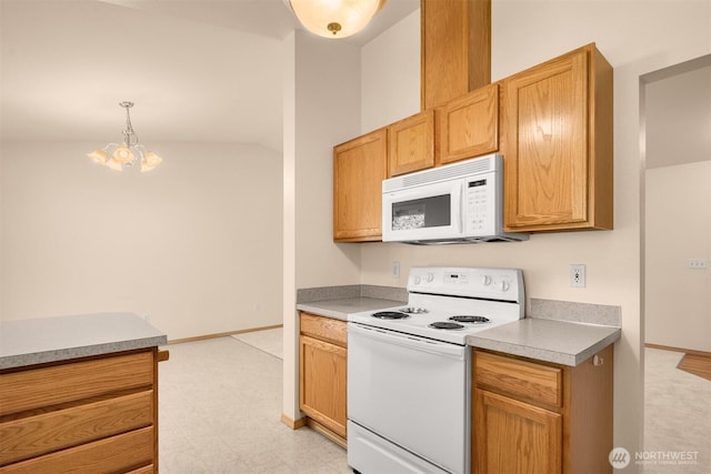 4050 NE 197th St, Lake Forest Park, WA 98155 - kitchen with white appliances, light floors, a chandelier, light countertops, and decorative light fixtures