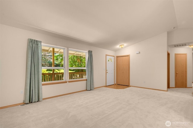 4050 NE 197th St, Lake Forest Park, WA 98155 - carpeted empty room featuring lofted ceiling and baseboards