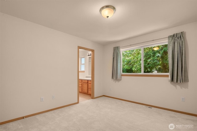 4050 NE 197th St, Lake Forest Park, WA 98155 - spare room featuring baseboards and light carpet