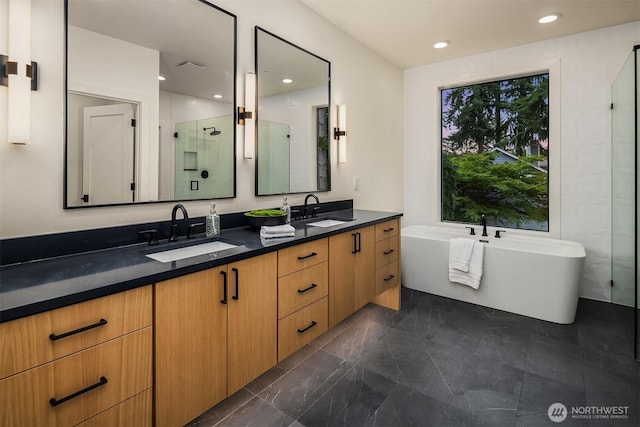 11618 NE 111th St, Kirkland, WA 98033 - bathroom with double vanity, a freestanding tub, a stall shower, recessed lighting, and marble finish floors