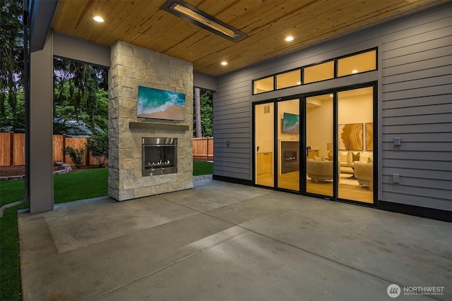 11618 NE 111th St, Kirkland, WA 98033 - view of patio with an outdoor stone fireplace
