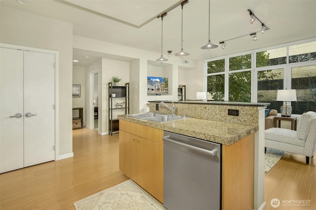 17 W Mercer St Unit 212, Seattle, WA 98119 - kitchen with dishwasher, open floor plan, light wood-type flooring, and a center island with sink