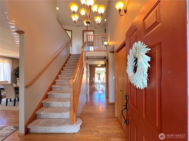 26504 126th Pl SE, Kent, WA 98030 - foyer with stairs, light wood-type flooring, a chandelier, and a high ceiling