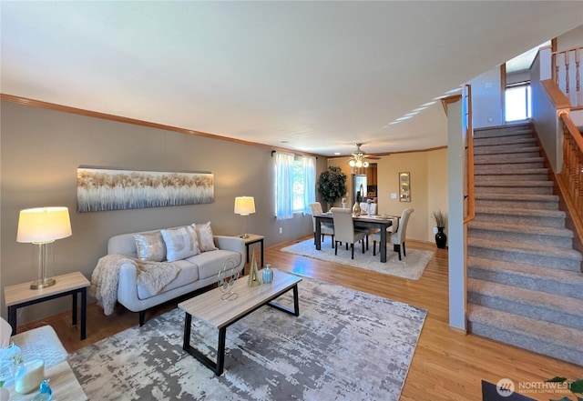 26504 126th Pl SE, Kent, WA 98030 - living area featuring stairs, wood finished floors, a ceiling fan, and ornamental molding