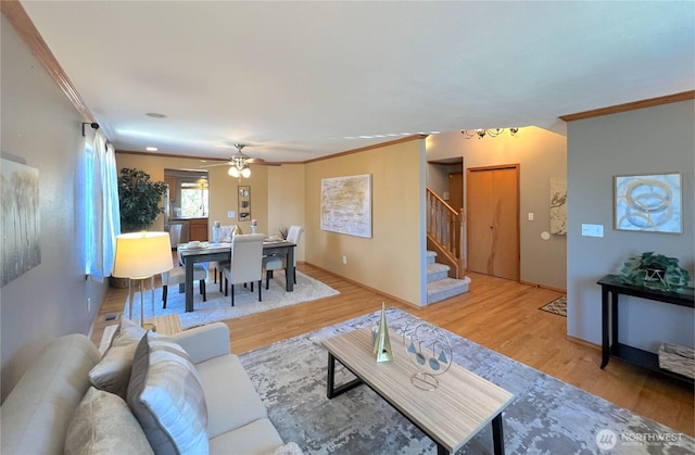 26504 126th Pl SE, Kent, WA 98030 - living room with stairs, ornamental molding, wood finished floors, a chandelier, and ceiling fan