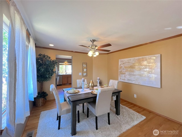 26504 126th Pl SE, Kent, WA 98030 - dining area with ornamental molding, light wood-style floors, and ceiling fan