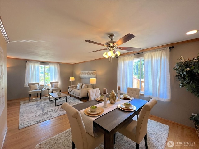 26504 126th Pl SE, Kent, WA 98030 - dining space with light wood finished floors, a ceiling fan, and ornamental molding