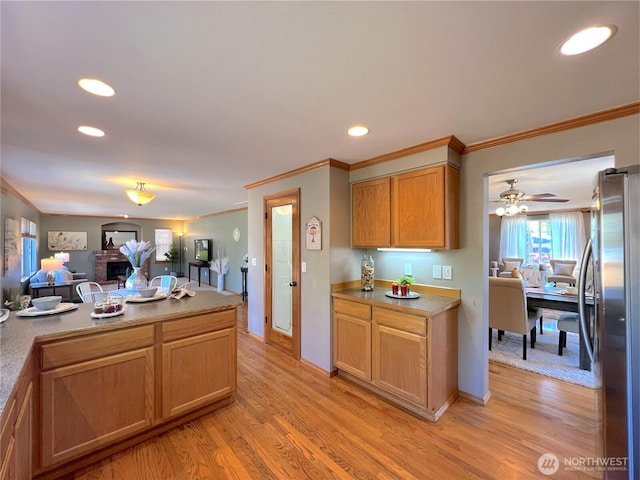 26504 126th Pl SE, Kent, WA 98030 - kitchen with freestanding refrigerator, crown molding, open floor plan, recessed lighting, and light wood finished floors