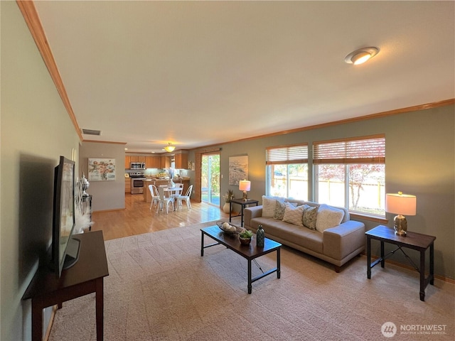 26504 126th Pl SE, Kent, WA 98030 - living area with ornamental molding and light wood-style flooring