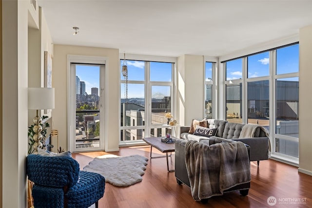2721 1st Ave Unit 1101, Seattle, WA 98121 - living area with wood finished floors and a city view