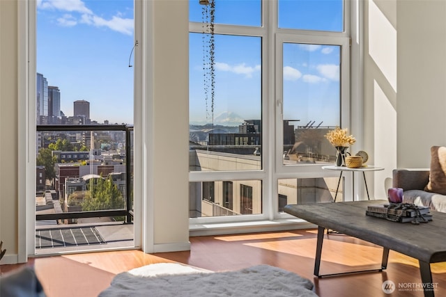 2721 1st Ave Unit 1101, Seattle, WA 98121 - bedroom featuring wood finished floors, a city view, and access to exterior